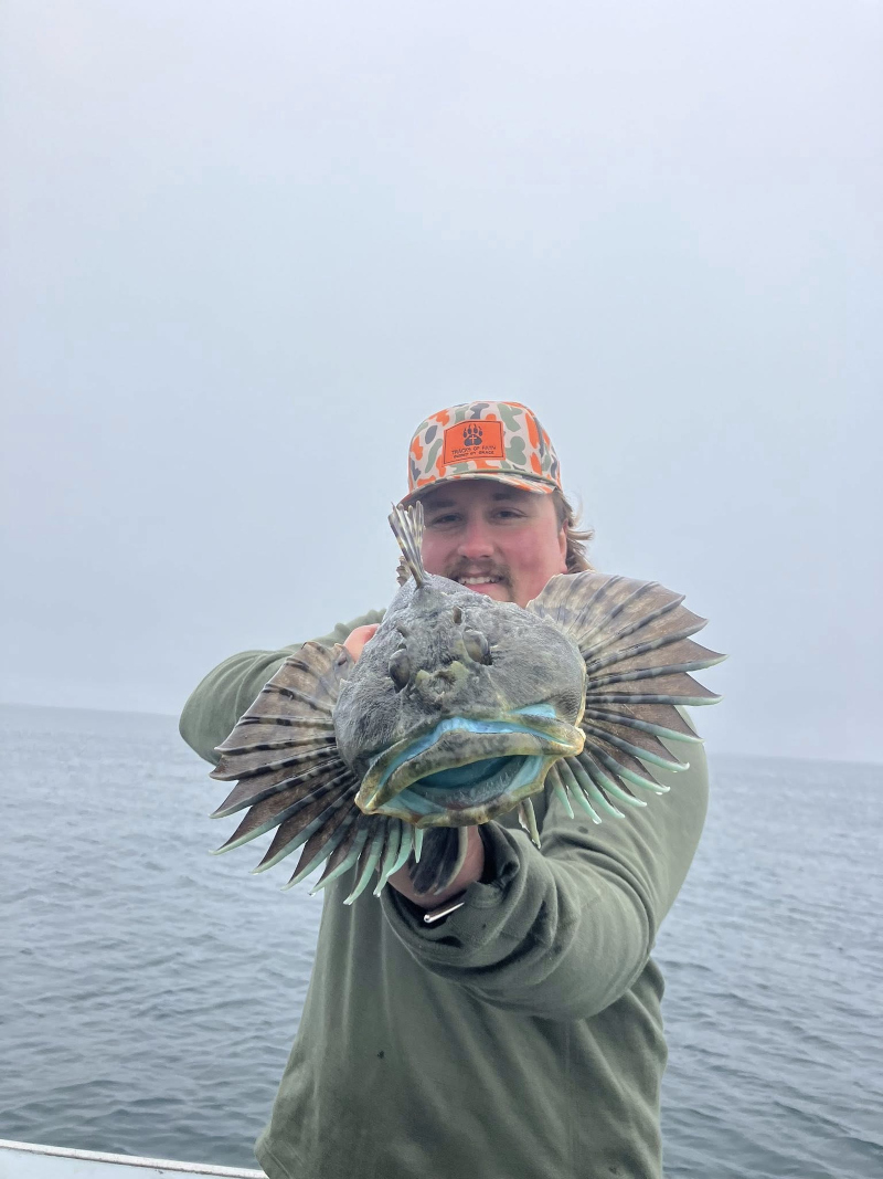 A happy Angler holding his catch